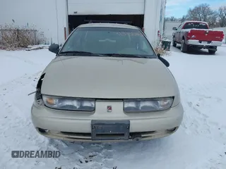 1999 Saturn SW z VIN 1G8ZK8276XZ295812, wystawiony jako IAAI lot #41313503 z przebiegiem 120 857 mil mil oraz . Historia ofert i sprzedaży dostępna na DreamBid. Obrazek 13.