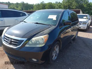 2010 Honda Odyssey Touring with VIN 5FNRL3H97AB104359, listed as a IAAI auction lot 42555872 with 233,952 mi miles and . Bid and sale history available at DreamBid. Image 2.