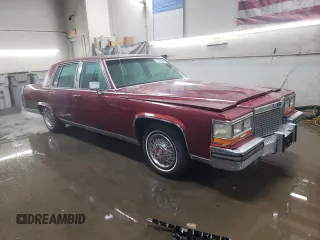 1988 Cadillac Brougham z VIN 1G6DW51Y2JR766782, wystawiony jako Copart lot #83797924 z przebiegiem 63 601 mil mil oraz Szkody całkowita. Historia ofert i sprzedaży dostępna na DreamBid. Obrazek 4.