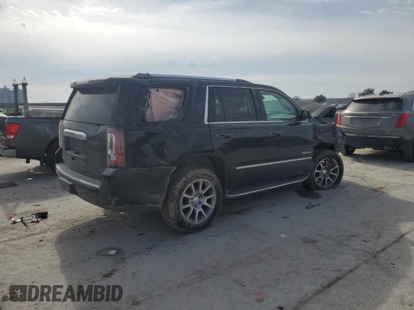 2015 GMC Yukon Denali with VIN 1GKS1CKJ2FR699959, listed as a Copart auction lot 42035195 with 0 mi miles and Salvage Title. Bid and sale history available at carsss.com. Image 3.