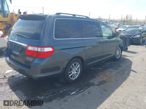 2005 Honda Odyssey TOURING with VIN 5FNRL38855B091754, listed as a IAAI auction lot 42131326 with 258,635 mi miles. Bid and sale history available at carsss.com. Image 4.