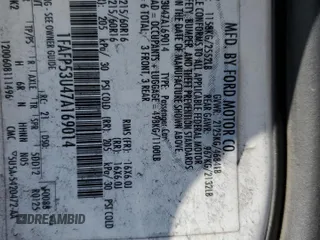 2007 Ford Taurus SE z VIN 1FAFP53U47A169014, wystawiony jako Copart lot #51858765 z przebiegiem Nie podano mil oraz Szkody całkowita. Historia ofert i sprzedaży dostępna na DreamBid. Obrazek 14.