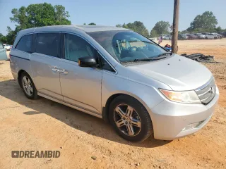 2012 Honda Odyssey Touring с VIN 5FNRL5H93CB137468, выставлен на аукционе Copart как лот 59330545 с пробегом 105 880 миль миль и Списание • Salvage title. История ставок и продаж доступна на DreamBid. Изображение 4.