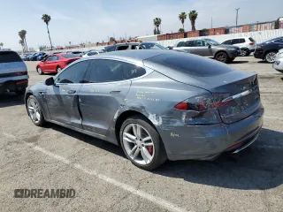 2014 Tesla Model S 60 z VIN 5YJSA1H17EFP36595, wystawiony jako Copart lot #53705035 z przebiegiem 148 254 mil mil oraz Szkoda całkowita • Salvage title. Historia ofert i sprzedaży dostępna na DreamBid. Obrazek 2.
