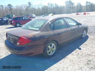 2001 Ford Taurus SES with VIN 1FAFP55U51G265509, listed as a IAAI auction lot 41886979 with 249,492 mi miles. Bid and sale history available at carsss.com. Image 4.