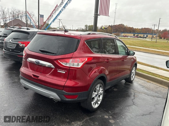 2014 Ford Escape Titanium with VIN 1FMCU0JX8EUC19300, listed as a Copart auction lot 79009664 with 111,705 mi miles and Clean Title. Bid and sale history available at carsss.com. Image 4.