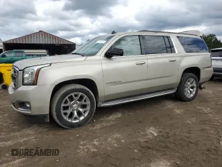2015 GMC Yukon XL SLT with VIN 1GKS1HKC5FR168608, listed as a Copart auction lot 71564384 with 197,538 mi miles and Salvage Title. Bid and sale history available at carsss.com. Image 1.