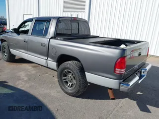 2001 Dodge Dakota Sport with VIN 1B7HL2AN21S319390, listed as a IAAI auction lot 40836729 with 118,823 mi miles. Bid and sale history available at carsss.com. Image 3.