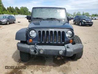 2011 Jeep Wrangler Unlimited Rubicon with VIN 1J4BA6H16BL561658, listed as a Copart auction lot 58379755 with 103,587 mi miles and Salvage title. Bid and sale history available at DreamBid. Image 5.