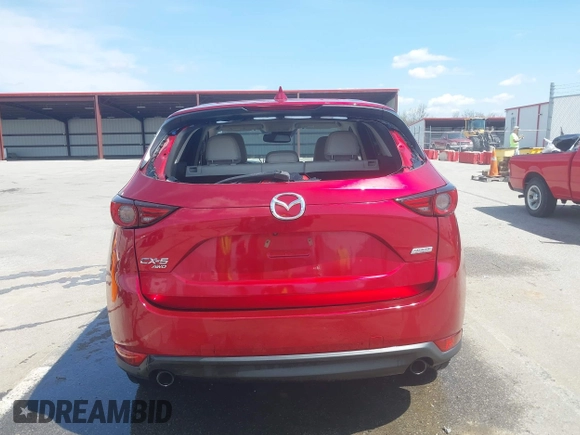 2018 Mazda CX-5 Grand Touring with VIN JM3KFBDM6J0424663, listed as a IAAI auction lot 42003207 with 95,442 mi miles and . Bid and sale history available at DreamBid. Image 16.