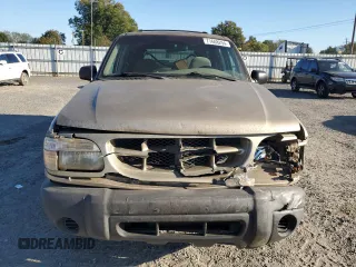1999 Ford Explorer XL with VIN 1FMZU34X2XUA28059, listed as a Copart auction lot 77668294 with 131,064 mi miles and Salvage title. Bid and sale history available at DreamBid. Image 5.