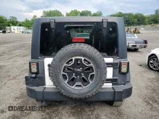 2014 Jeep Wrangler Unlimited Rubicon with VIN 1C4HJWFG4EL114743, listed as a Copart auction lot 61397575 with 110,222 mi miles and Salvage title. Bid and sale history available at DreamBid. Image 6.