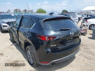 2017 Mazda CX-5 Touring with VIN JM3KFACL0H0124632, listed as a IAAI auction lot 42134971 with 107,029 mi miles and . Bid and sale history available at carsss.com. Image 3.