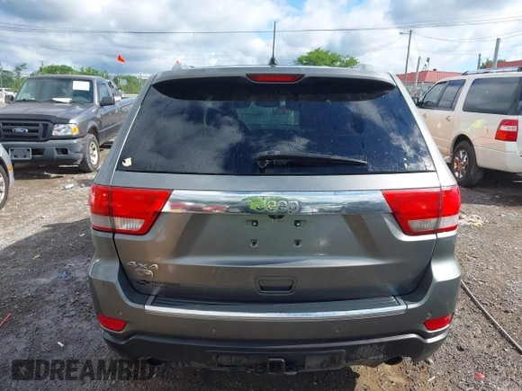 2011 Jeep Grand Cherokee Overland Summit with VIN 1J4RR6GT3BC713812, listed as a IAAI auction lot 42398585 with 208,476 mi miles and . Bid and sale history available at DreamBid. Image 16.