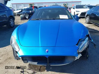 2013 Maserati GranTurismo Sport with VIN ZAM45VLA5D0070499, listed as a IAAI auction lot 41284315 with 50,156 mi miles. Bid and sale history available at carsss.com. Image 13.