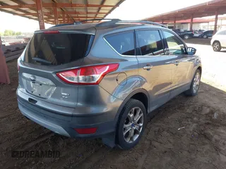 2014 Ford Escape SE z VIN 1FMCU9GX1EUA28135, wystawiony jako IAAI lot #42617623 z przebiegiem 144 824 mil mil oraz . Historia ofert i sprzedaży dostępna na DreamBid. Obrazek 4.