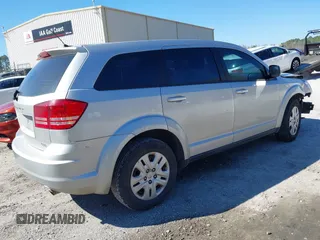 2014 Dodge Journey American Value Pkg with VIN 3C4PDCAB7ET259230, listed as a IAAI auction lot 41675179 with 151,386 mi miles. Bid and sale history available at carsss.com. Image 4.
