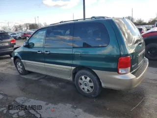 2002 Kia Sedona LX with VIN KNDUP131426217512, listed as a Copart auction lot 80928774 with 163,176 mi miles and Salvage Title. Bid and sale history available at carsss.com. Image 2.