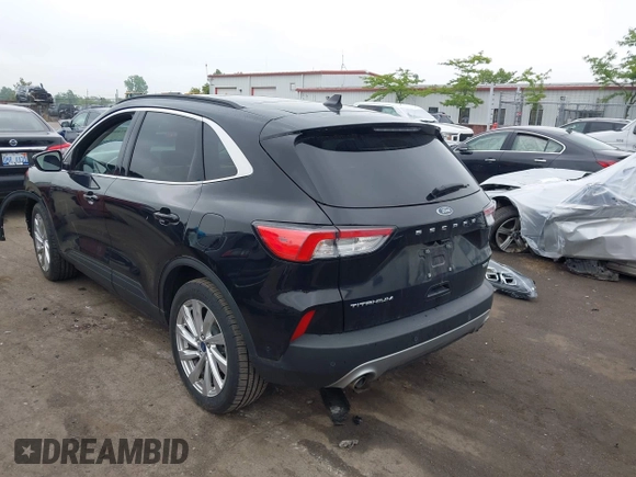 2021 Ford Escape Titanium Hybrid with VIN 1FMCU9DZ5MUA18079, listed as a IAAI auction lot 42340093 with 71,630 mi miles and . Bid and sale history available at DreamBid. Image 3.