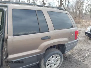 2001 Jeep Grand Cherokee Laredo with VIN 1J4GW48SX1C658610, listed as a IAAI auction lot 41831013 with 200,142 mi miles and . Bid and sale history available at DreamBid. Image 6.