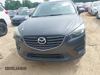 2016 Mazda CX-5 Grand Touring z VIN JM3KE2DY5G0801238, wystawiony jako IAAI lot #42264694 z przebiegiem 136 993 mil mil oraz . Historia ofert i sprzedaży dostępna na DreamBid. Obrazek 11.