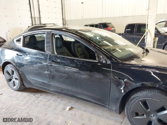 2023 Tesla Model 3 with VIN 5YJ3E1EA1PF458888, listed as a IAAI auction lot 41730104 with 82,995 mi miles. Bid and sale history available at carsss.com. Image 6.