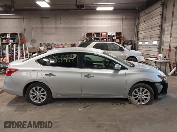 2019 Nissan Sentra S z VIN 3N1AB7AP7KY345072, wystawiony jako IAAI lot #41284957 z przebiegiem 104 084 mil mil oraz . Historia ofert i sprzedaży dostępna na DreamBid. Obrazek 14.