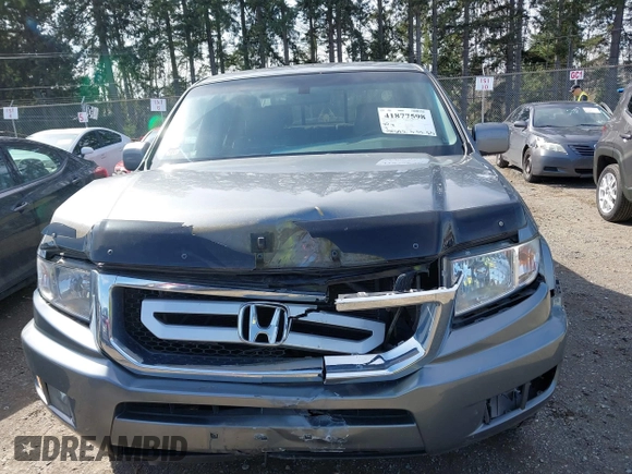2009 Honda Ridgeline RTL with VIN 5FPYK16599B100707, listed as a IAAI auction lot 41877598 with 130,622 mi miles and . Bid and sale history available at DreamBid. Image 12.