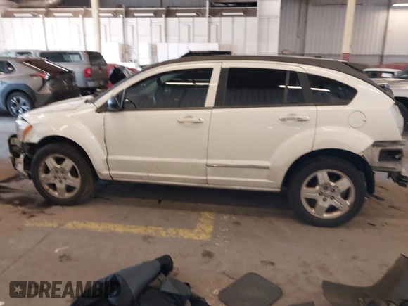 2009 Dodge Caliber SXT with VIN 1B3HB48A89D116734, listed as a IAAI auction lot 41959281 with 209,136 mi miles and . Bid and sale history available at DreamBid. Image 15.