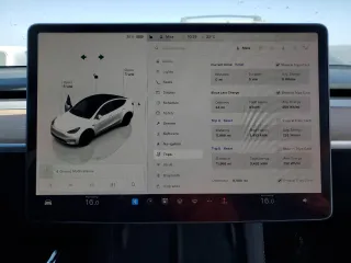 2023 Tesla Model Y Long Range z VIN 7SAYGDEE2PA061792, wystawiony jako Copart lot #52106965 z przebiegiem 11 968 mil mil oraz Szkoda całkowita • Salvage title. Historia ofert i sprzedaży dostępna na DreamBid. Obrazek 9.
