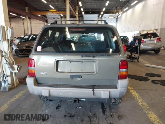 1996 Jeep Grand Cherokee Laredo with VIN 1J4GZ58S9TC293787, listed as a IAAI auction lot 41179368 with 141,755 mi miles. Bid and sale history available at carsss.com. Image 17.