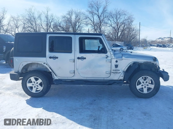 2012 Jeep Wrangler Unlimited Sport z VIN 1C4HJWDG3CL224800, wystawiony jako IAAI lot #41569279 z przebiegiem 174 336 mil mil oraz . Historia ofert i sprzedaży dostępna na DreamBid. Obrazek 14.