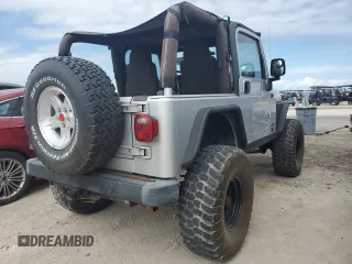 2003 Jeep Wrangler Rubicon z VIN 1J4FA69S53P340085, wystawiony jako Copart lot #74564574 z przebiegiem Nie podano mil oraz Szkoda całkowita • Salvage title. Historia ofert i sprzedaży dostępna na DreamBid. Obrazek 3.