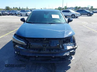 2025 Honda Civic Sport z VIN 2HGFE2F59SH530459, wystawiony jako IAAI lot #41698287 z przebiegiem 19 987 mil mil oraz . Historia ofert i sprzedaży dostępna na DreamBid. Obrazek 13.