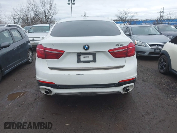 2015 BMW X6 xDrive35i with VIN 5UXKU2C57F0N77194, listed as a IAAI auction lot 41818860 with 105,579 mi miles and . Bid and sale history available at DreamBid. Image 16.
