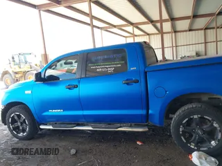 2012 Toyota Tundra with VIN 5TFEY5F16CX120263, listed as a IAAI auction lot 42238248 with 146,577 mi miles and . Bid and sale history available at DreamBid. Image 14.