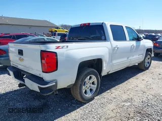 2017 Chevrolet Silverado 1500 LT with VIN 3GCUKREC3HG489701, listed as a IAAI auction lot 41814860 with 218,605 mi miles. Bid and sale history available at carsss.com. Image 4.