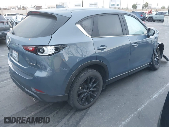 2024 Mazda CX-5 S Carbon Edition z VIN JM3KFBCM6R0359097, wystawiony jako IAAI lot #41743569 z przebiegiem 13 114 mil mil oraz . Historia ofert i sprzedaży dostępna na DreamBid. Obrazek 4.