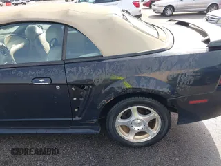 2004 Ford Mustang Deluxe with VIN 1FAFP446X4F187154, listed as a IAAI auction lot 42068363 with 125,074 mi miles. Bid and sale history available at carsss.com. Image 6.