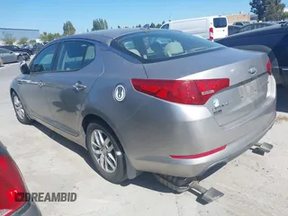 2013 Kia Optima LX with VIN KNAGM4A72D5399117, listed as a IAAI auction lot 42174312 with 105,661 mi miles and . Bid and sale history available at carsss.com. Image 3.