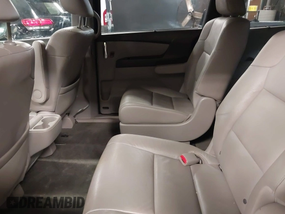 2014 Honda Odyssey Touring with VIN 5FNRL5H94EB105745, listed as a IAAI auction lot 41744012 with 77,032 mi miles and . Bid and sale history available at DreamBid. Image 8.