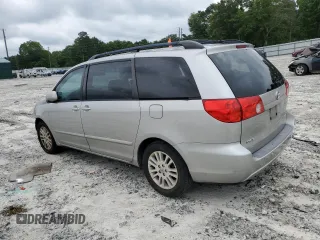 2010 Toyota Sienna XLE with VIN 5TDYK4CC1AS322395, listed as a Copart auction lot 60520215 with 148,725 mi miles and Salvage title. Bid and sale history available at DreamBid. Image 2.