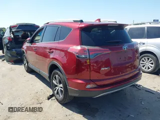 2018 Toyota RAV4 XLE with VIN 2T3WFREV8JW425464, listed as a IAAI auction lot 41977877 with 142,265 mi miles and . Bid and sale history available at carsss.com. Image 3.