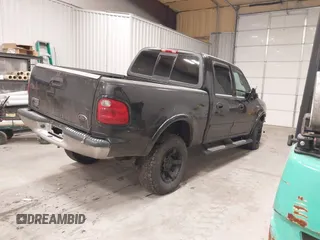 2002 Ford F-150 XLT with VIN 1FTRW08L62KC00490, listed as a IAAI auction lot 41380406 with 192,013 mi miles. Bid and sale history available at carsss.com. Image 4.