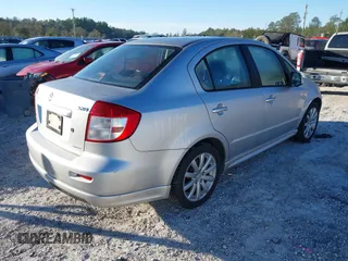 2010 Suzuki SX4 with VIN JS2YC5A46A6310134, listed as a IAAI auction lot 41696108 with 147,059 mi miles and . Bid and sale history available at DreamBid. Image 4.