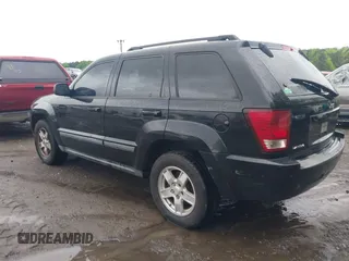 2007 Jeep Grand Cherokee Laredo with VIN 1J8GS48K57C516037, listed as a IAAI auction lot 41982692 with 273,961 mi miles. Bid and sale history available at carsss.com. Image 3.
