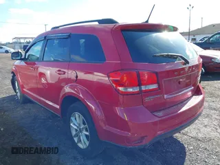 2017 Dodge Journey SXT z VIN 3C4PDDBG1HT577753, wystawiony jako IAAI lot #41855579 z przebiegiem 123 185 mil mil oraz . Historia ofert i sprzedaży dostępna na DreamBid. Obrazek 3.