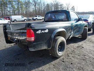 1999 Dodge Dakota SLT with VIN 1B7FL26X0XS208461, listed as a IAAI auction lot 41492338 with 185,400 mi miles. Bid and sale history available at carsss.com. Image 4.