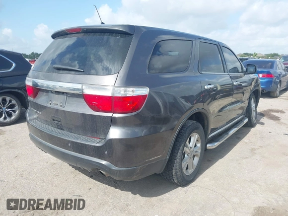2013 Dodge Durango SXT with VIN 1C4RDHAG4DC686389, listed as a IAAI auction lot 42440260 with 166,952 mi miles and . Bid and sale history available at DreamBid. Image 4.