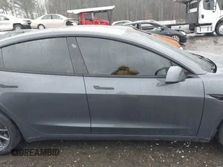 2023 Tesla Model 3 z VIN 5YJ3E1EA3PF579776, wystawiony jako IAAI lot #41537794 z przebiegiem Nie podano mil oraz . Historia ofert i sprzedaży dostępna na DreamBid. Obrazek 13.